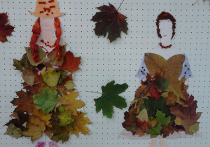 Na zdjęciu widać dwie sylwetki przedstawiające Panią Jesień ozdobione: kredkami, bibułą, liśćmi,koralami jarzębiny.